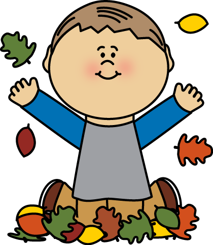 Boy Playing in Autumn Leaves