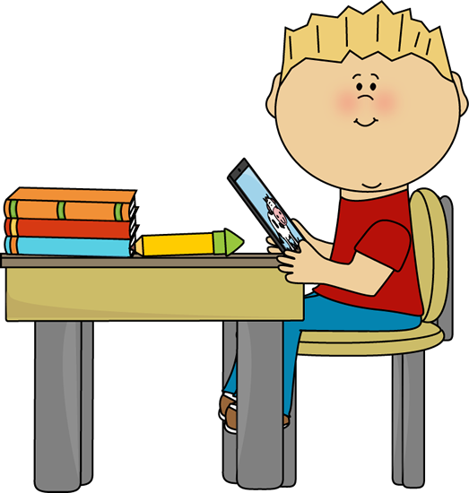 Boy Sitting at School Desk with a Tablet